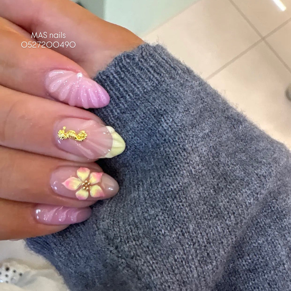 3D floral and shell nail art with aura gel and pearls at MAS Beauty Salon Dubai