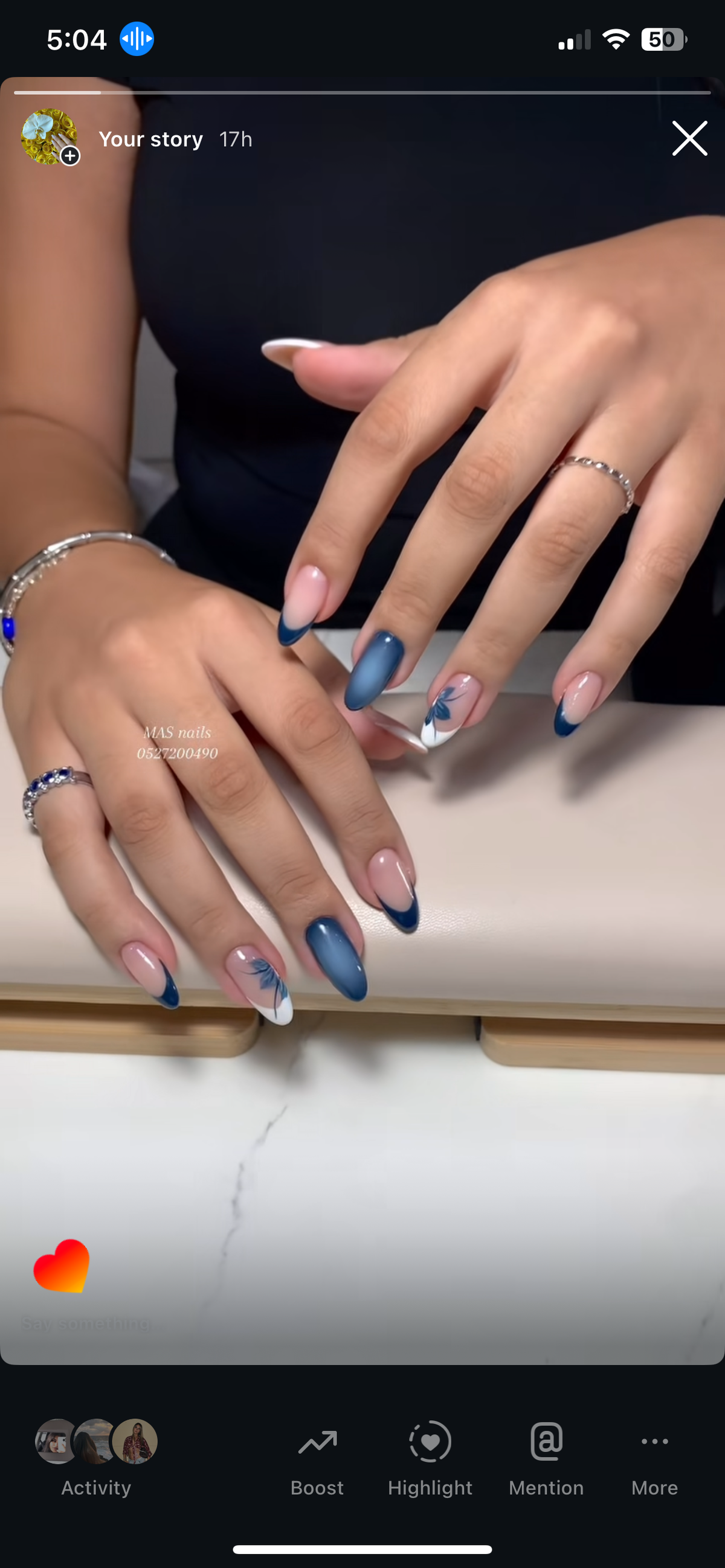 Hand painted blue floral nail art with aura gel extensions at MAS Beauty Salon Dubai